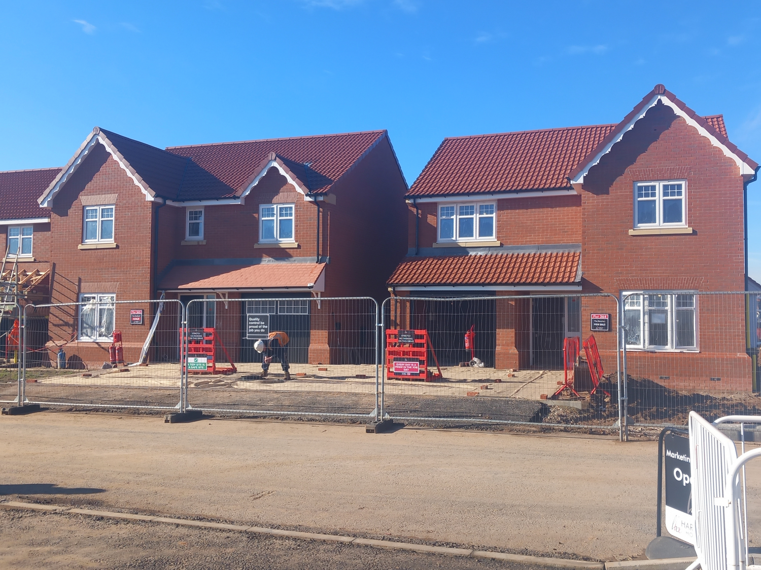 New residential houses under construction at a Harron Homes site.